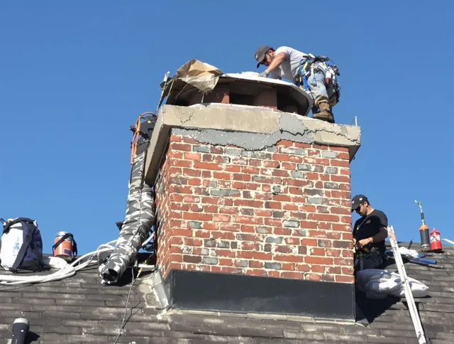 New Albany Chimney Sweep installing a custom chimney crown in New Albany, OH