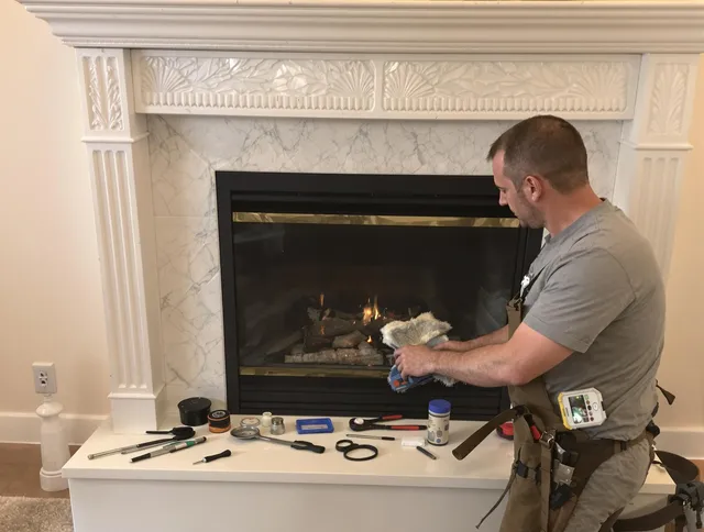 New Albany Chimney Sweep performing fireplace maintenance in New Albany, OH