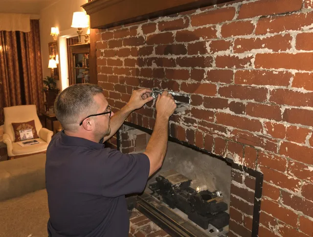 New Albany Chimney Sweep expert fixing a fireplace in New Albany, OH